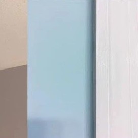 Painted wall meeting white door trim, from their About collage